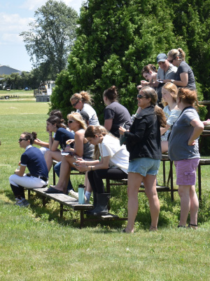 several people in the bleachers auditing an event